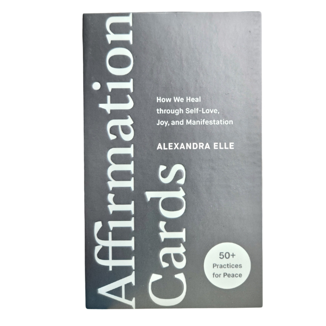 Cover of "Affirmation Cards: How We Heal through Self-Love, Joy, and Manifestation," by Alexandra Elle, showing a metallic gray background with the title in bold letters.